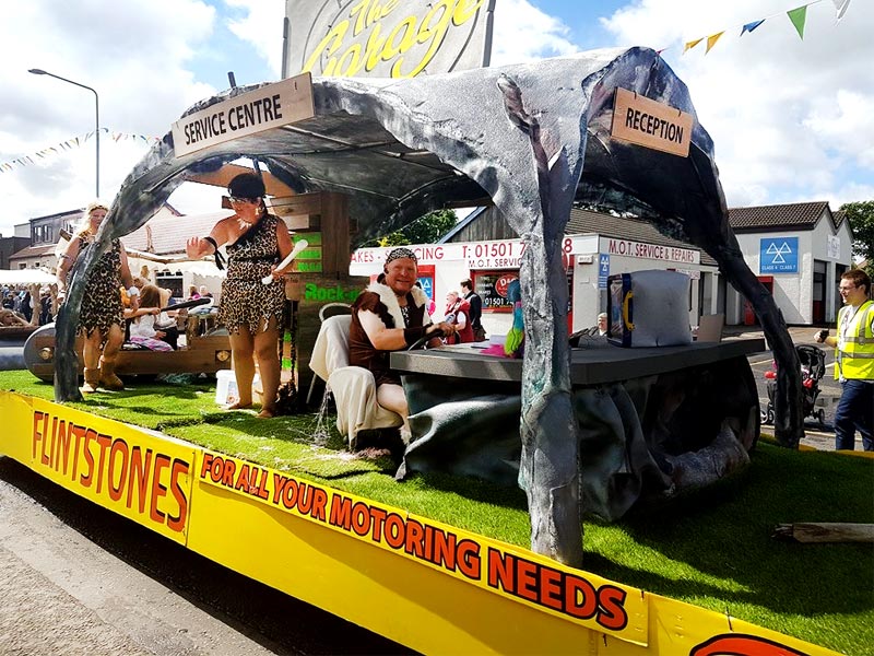 Whitburn Gala day scene showing Flintstones float